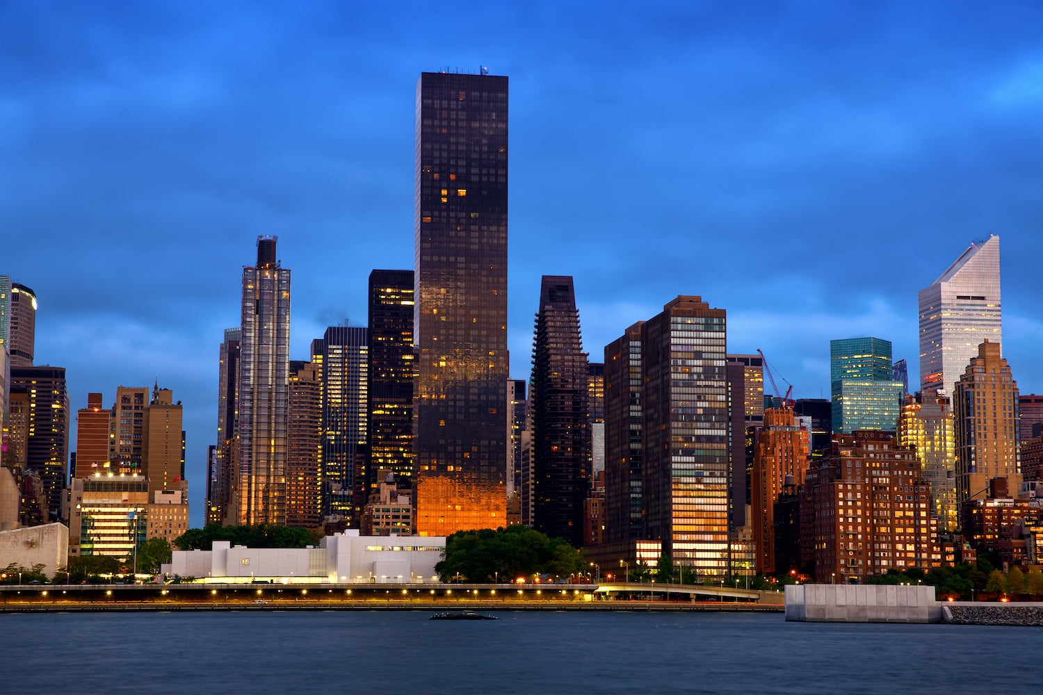 Marvel at the iconic Midtown Manhattan skyline featuring towering New York City buildings, blending modern architecture with historic landmarks in the heart of NYC.