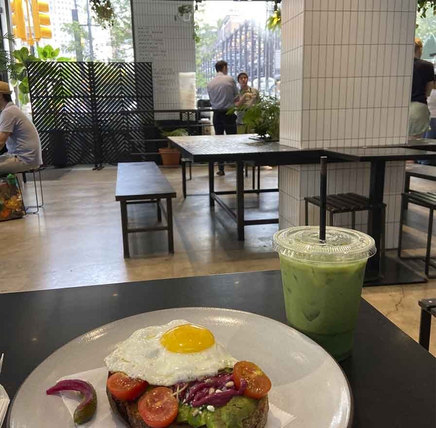 Avocado toast with egg and iced matcha at White Noise Coffee